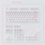 Whimsical My Melody ceramic keycaps set, showcasing exquisite craftsmanship and adorable designs with glossy pastel finishes from multiple angles.