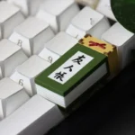 A close-up, artistic view of the Natsume's Book of Friends 2U keycap, showcasing its serene Japanese folklore design and collectible detail.
