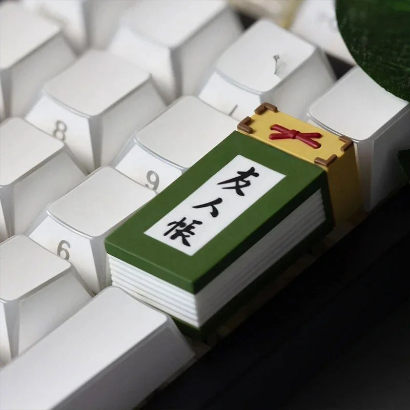 A close-up, artistic view of the Natsume's Book of Friends 2U keycap, showcasing its serene Japanese folklore design and collectible detail.