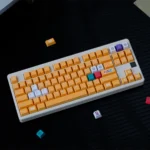 Premium Nintendo GameCube keycap set displayed from various angles, highlighting its nostalgic retro gaming design, vibrant yellow accents, and superior Cherry profile.