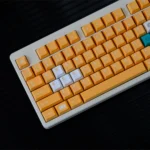 Premium Nintendo GameCube keycap set showcasing vibrant retro gaming aesthetic from multiple angles, highlighting the nostalgic design and comfortable Cherry profile.