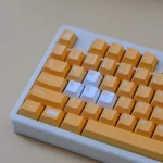 Premium Nintendo GameCube Keycap Set showcasing its retro gaming Cherry profile from multiple angles, highlighting vibrant yellow accents and nostalgic console design.