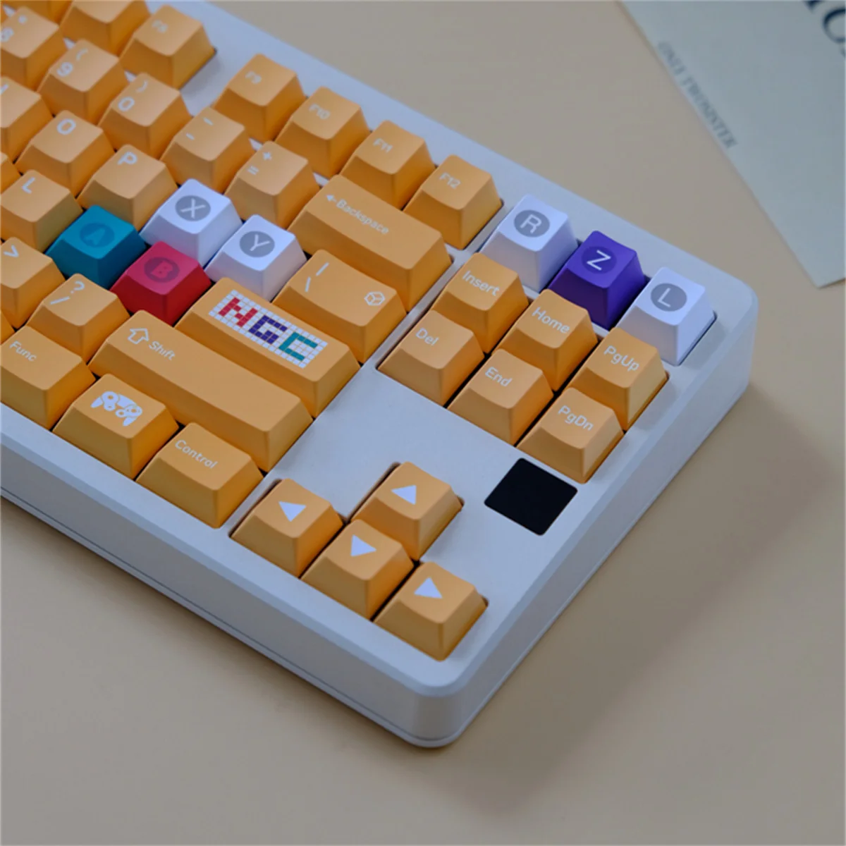Premium Nintendo GameCube keycap set showcasing its vibrant retro gaming design from multiple angles, highlighting the nostalgic yellow accents and Cherry profile.