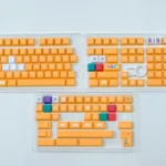 Premium Nintendo GameCube keycap set with vibrant retro gaming aesthetic, showcasing Cherry profile and nostalgic design from various angles.