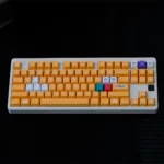 remium Nintendo GameCube keycap set featuring a nostalgic retro gaming design with vibrant yellow accents, crafted for an ergonomic Cherry profile.