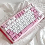 Adorable My Melody PBT Dye-Sub Keycap Set, featuring playful pastel pinks and iconic character art. Charming details from multiple angles for your keyboard.