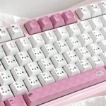 Close-up of adorable My Melody PBT dye-sub keycap set, highlighting the soft pastel pinks and iconic character art with playful charm.