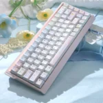 Pastel dessert keycaps in Cherry profile on a pink keyboard, with dye-sublimated PBT keys and hand-drawn sweets in a soft pink-blue palette.