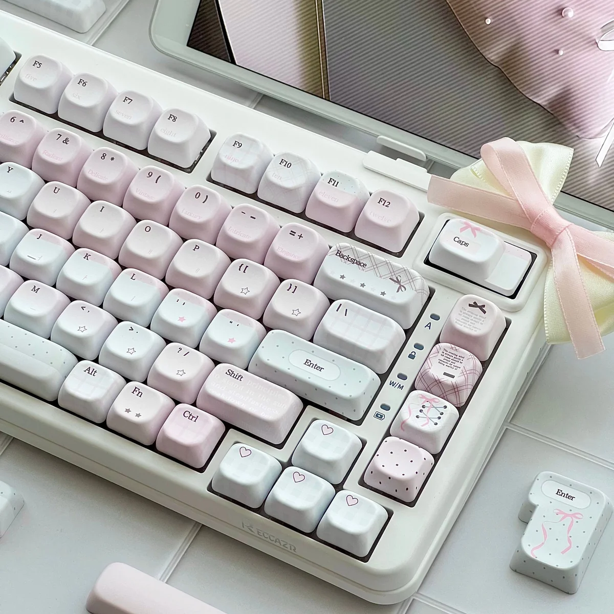 Pastel pink love letter keycaps with side-lit PBT legends, gingham accents, bows, and heart details create a dreamy romantic keyboard desk aesthetic.