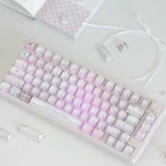 Pastel pink keycaps with gingham, bows, and heart details glow on a side-lit PBT full keycap set styled with ribbon and notebook.