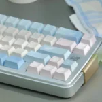 Multi-angle Poetic Tranquility PBT Keycap Set in pastel blue and pink, highlighting serene artistic design and PBT durability.