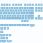 Translucent blue keycaps set with pearlescent glow, frosted ice-blue shine-through PBT/PC and delicate floral vine engravings.