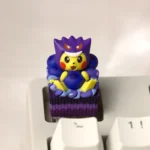 Dessert Cosplay Pikachu Pokemon artisan keycap with ultra-detailed 3D Pikachu in a Gengar hood on a purple cake base.