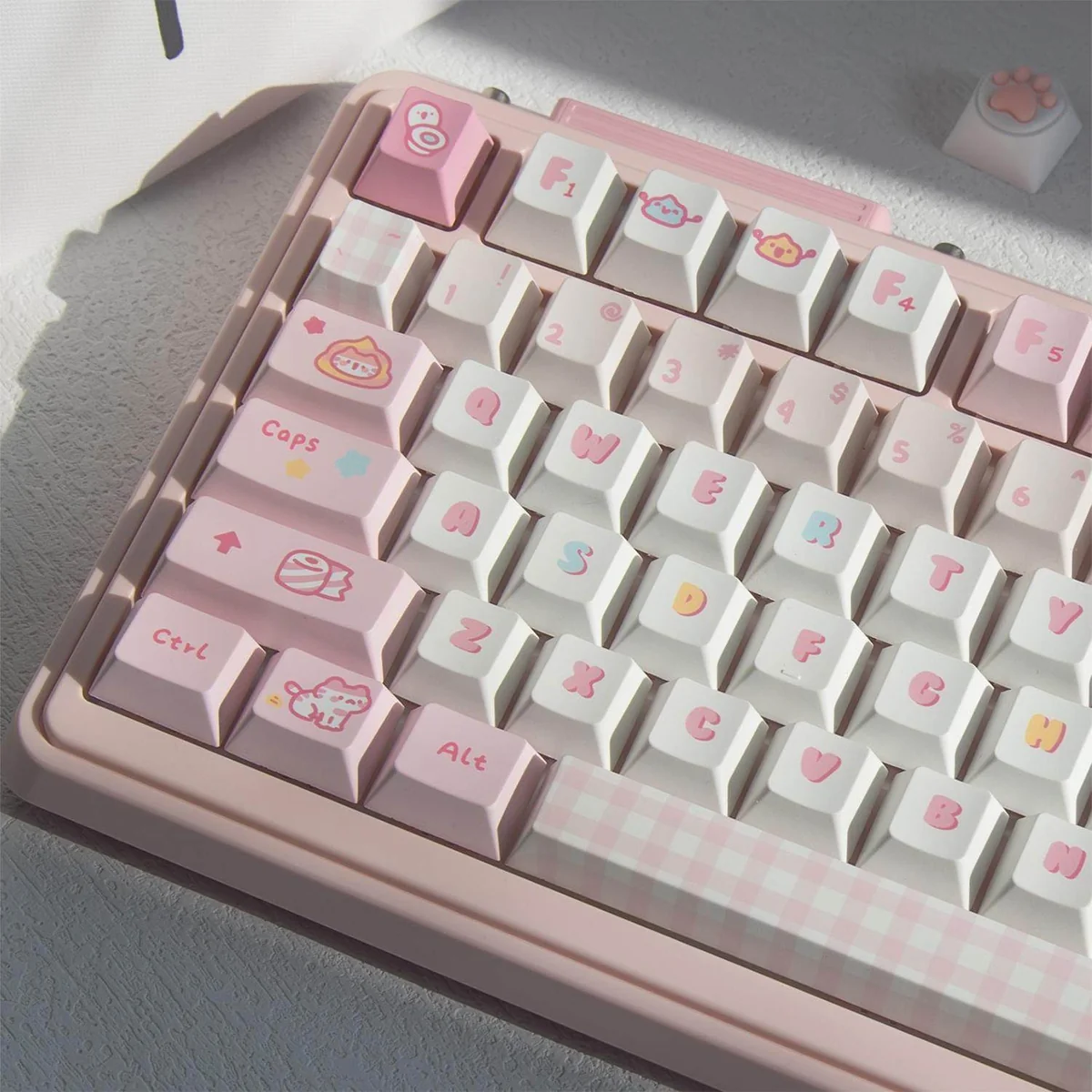 Product gallery of the 152-key Pooping Kitten Keycap Set, showcasing various charming cartoon feline designs and vibrant, whimsical keycap details.