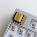 Premium zinc alloy metal accent keycaps displayed from multiple angles, showcasing sleek modern metallic finishes for a minimalist industrial elegance.