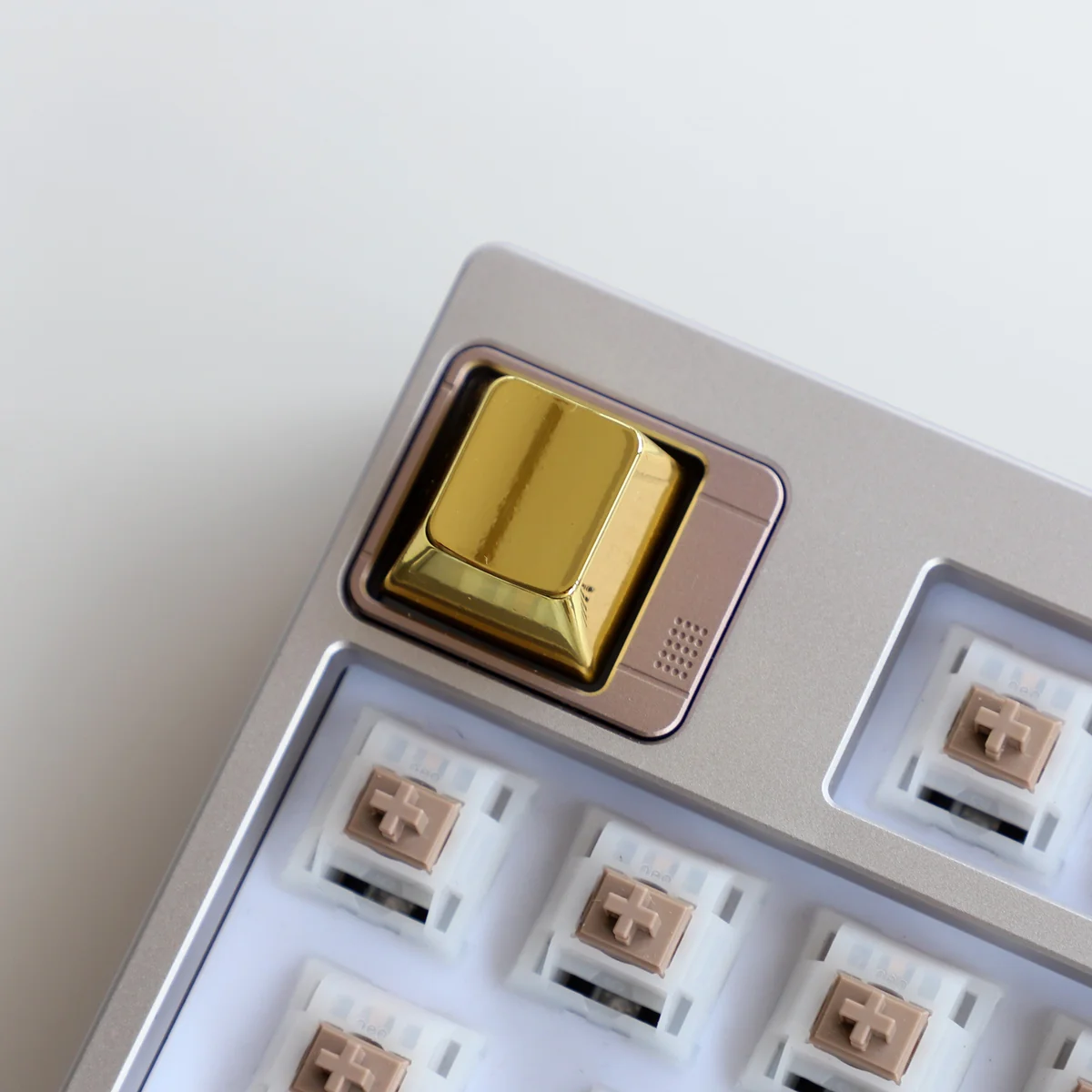 Premium zinc alloy metal accent keycaps displayed from multiple angles, showcasing sleek modern metallic finishes for a minimalist industrial elegance.