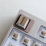 Premium zinc alloy metal keycap shown from multiple sleek angles, highlighting its modern minimalist design and industrial elegance.