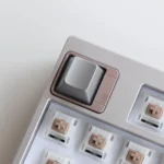 A gallery of premium zinc alloy metal accent keycaps, highlighting their sleek, modern metallic finishes and industrial elegance from multiple perspective.