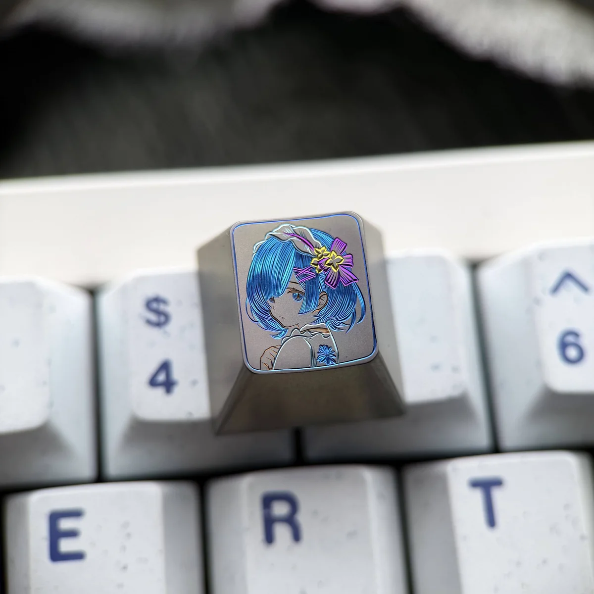 Vibrant Re:Zero Rem hand-carved titanium artisan keycap, showcasing intricate details and colorful lines from a unique angle, highlighting its artistry.