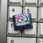 Artisan Tribute Rem Ram titanium keycap in deep blue-purple anodized finish, featuring pastel pink and teal twin-maid anime artwork on a keyboard.