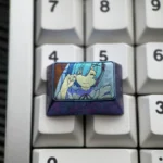 Violet-blue anodized Rem titanium keycap shown at a side angle, featuring pastel anime maid art and floral accents on a keyboard.