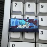 Violet-blue anodized Rem titanium keycap mounted on a white keyboard, showing vivid anime art, purple chain details, and floral side accents.