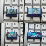 Violet-blue anodized titanium Rem keycap with pastel anime maid portraits and floral accents on a white keyboard.