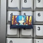 Rem titanium keycap from Re:Zero, anodized titanium artisan keycap with dreamy sky blue iridescent finish and anime portrait.