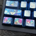 Rem titanium keycap set with vivid Re:Zero anime portraits, blue gradients, and iridescent anodized titanium artisan caps in dreamy sky tones.