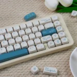 Elegant Rose Sonata MOA PBT keycaps showcasing a romantic rose garden motif and creamy texture from a unique angle, perfect for artistic typing.
