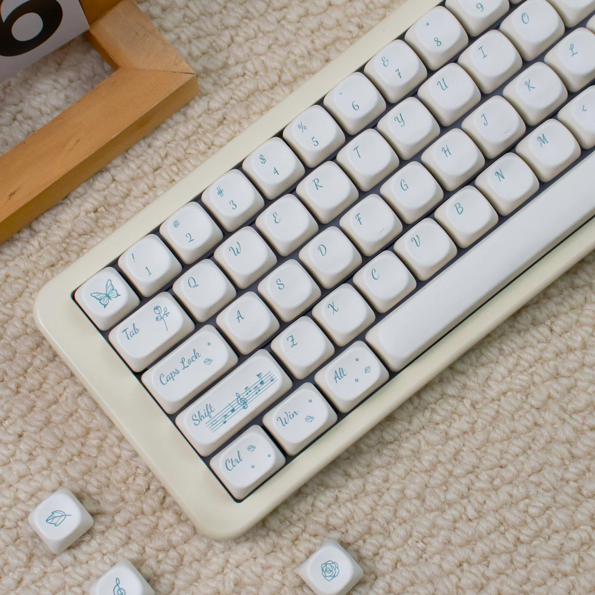 Rose Sonata MOA Keycaps: Detailed shot of creamy PBT, black legends, and rose garden motif. Highlights the unique MOA profile for artistic typing.