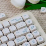 Elegant Rose Sonata MOA PBT keycaps, showcasing a creamy base, sophisticated black legends, and a romantic rose garden motif.