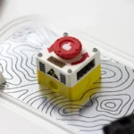 Captivating product images of the rotatable emergency keycap, highlighting its interactive red switch and industrial control panel design from diverse angles.