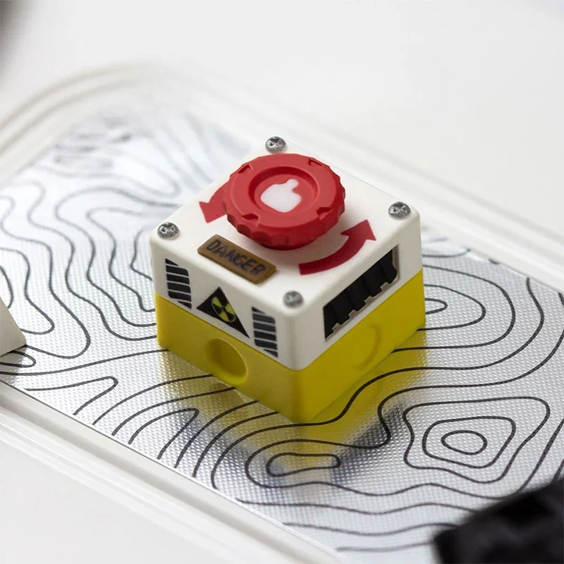 Captivating product images of the rotatable emergency keycap, highlighting its interactive red switch and industrial control panel design from diverse angles.