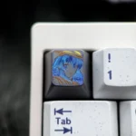 Exquisite hand-carved Mushoku Tensei Roxy titanium keycap, showcasing the intricate Roxy Loxolif design with vibrant colored lines and premium crafts.
