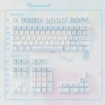 Whimsical Cinnamoroll ceramic MX keycaps set, displaying dreamy pastel designs and a smooth tactile finish. Unique, premium aesthetic shown from multiple angles.