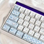 Close-up of durable PBT Cinnamoroll keycaps, highlighting authentic dreamy character art and whimsical pastel hues for joyful personalization.
