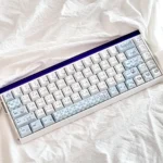 Dreamy Cinnamoroll PBT keycaps set showcasing adorable character art in soft pastel hues, offering durable PBT for joyful, personalized keyboard styles.
