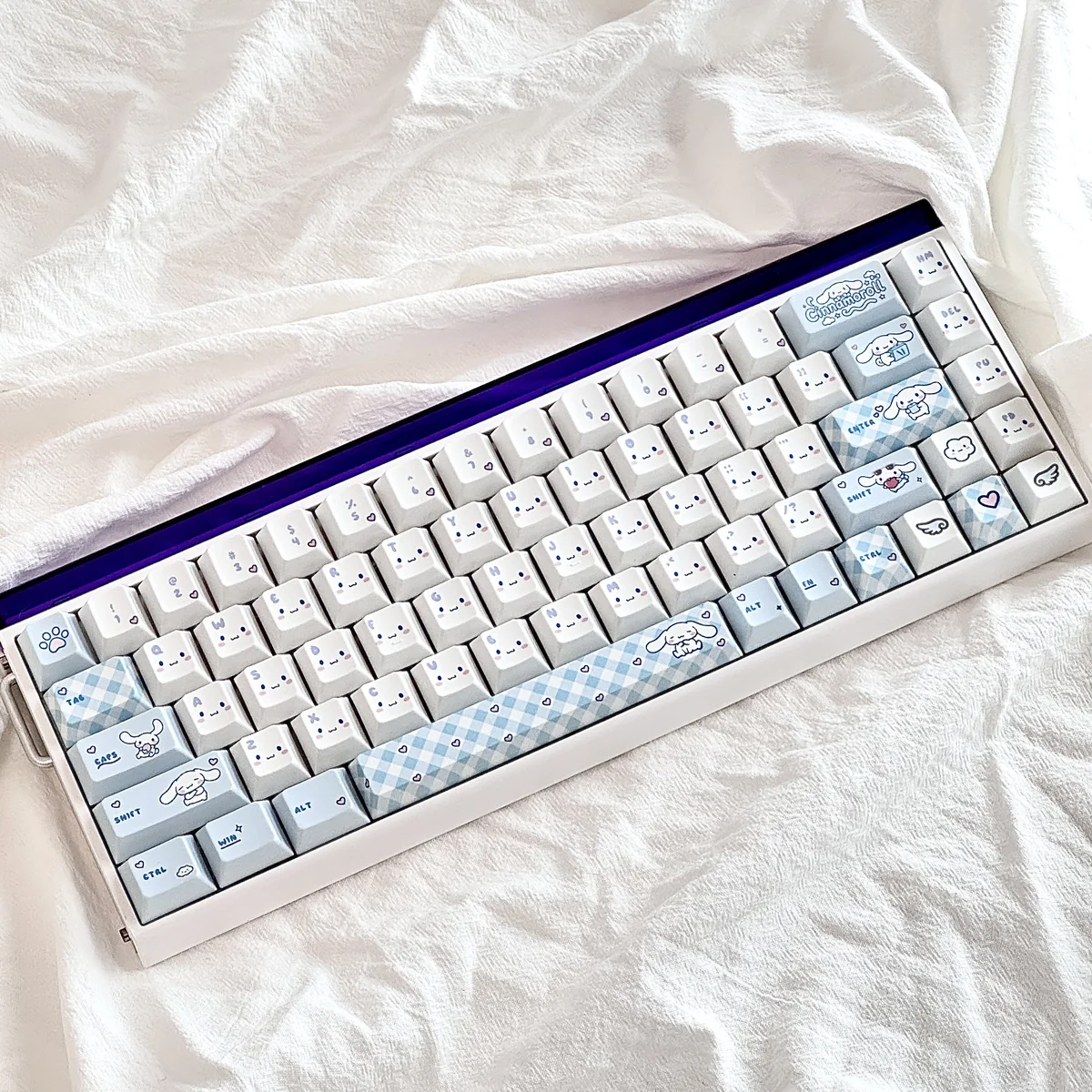 Dreamy Cinnamoroll PBT keycaps set showcasing adorable character art in soft pastel hues, offering durable PBT for joyful, personalized keyboard styles.