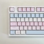 A serene Sky of Love Cherry Keycap Set, showcasing ethereal legends and soft pastel hues from multiple angles, highlighting the full, dreamy setup.