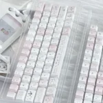 Sleepwalking pink and white PBT Cherry keycap set, shown from multiple angles. Highlights the soft pastel glow and dreamy, whimsical aesthetic for playful typing experience.