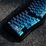 Cosmic Journey Starry Keycap Set, an immersive deep blue and purple galaxy design from a unique angle, highlighting nebulae and stars.