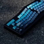 Cosmic Journey Starry Keycap Set, showing its immersive galaxy design with deep blue, purple, and blue-green nebulae and stars, highlighting an artistic design.