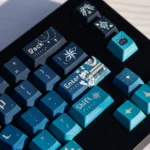 Close-up of the Cosmic Journey Starry Keycap Set, showcasing its immersive deep blue and purple galaxy design, filled with nebulae and stars.