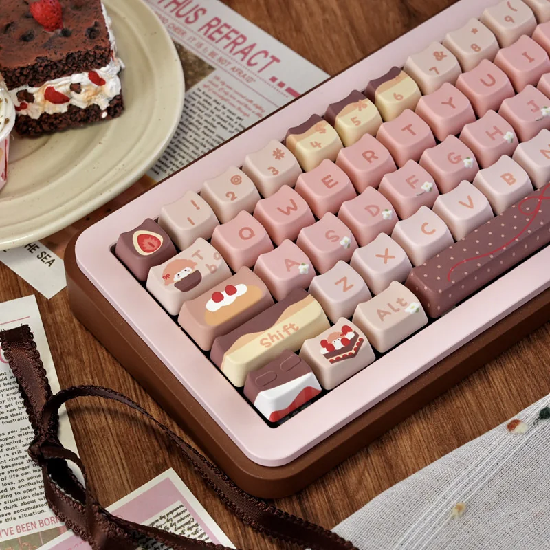 Angled view of pastel pink and chocolate brown Strawberry Chocolate keycaps with dessert and gingham motifs, dye-sublimated PBT MOA profile.