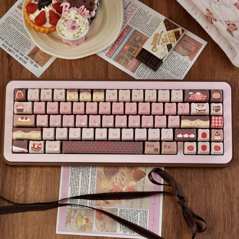 Strawberry Chocolate keycaps in pastel pink and brown feature dye-sublimated PBT MOA dessert art with strawberry cake and gingham motifs.
