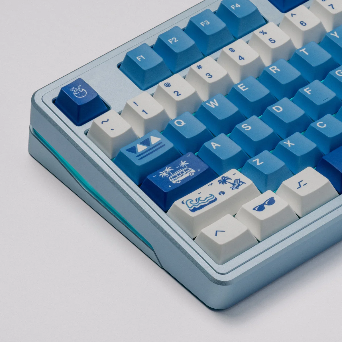 The Surfing Keycap Set, showcasing its vibrant blue and white ocean wave aesthetic for mechanical keyboards, is displayed from multiple angles.