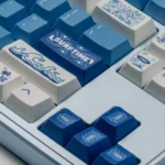 Artistic display of the Surfing Keycap Set from various angles, revealing its unique ocean waves aesthetic and vibrant blue and white design for mechanical keyboard.