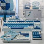 Surfing Keycap Set for mechanical keyboards, featuring a unique ocean waves aesthetic in vibrant blue and white, evoking serene summer beach vibes.