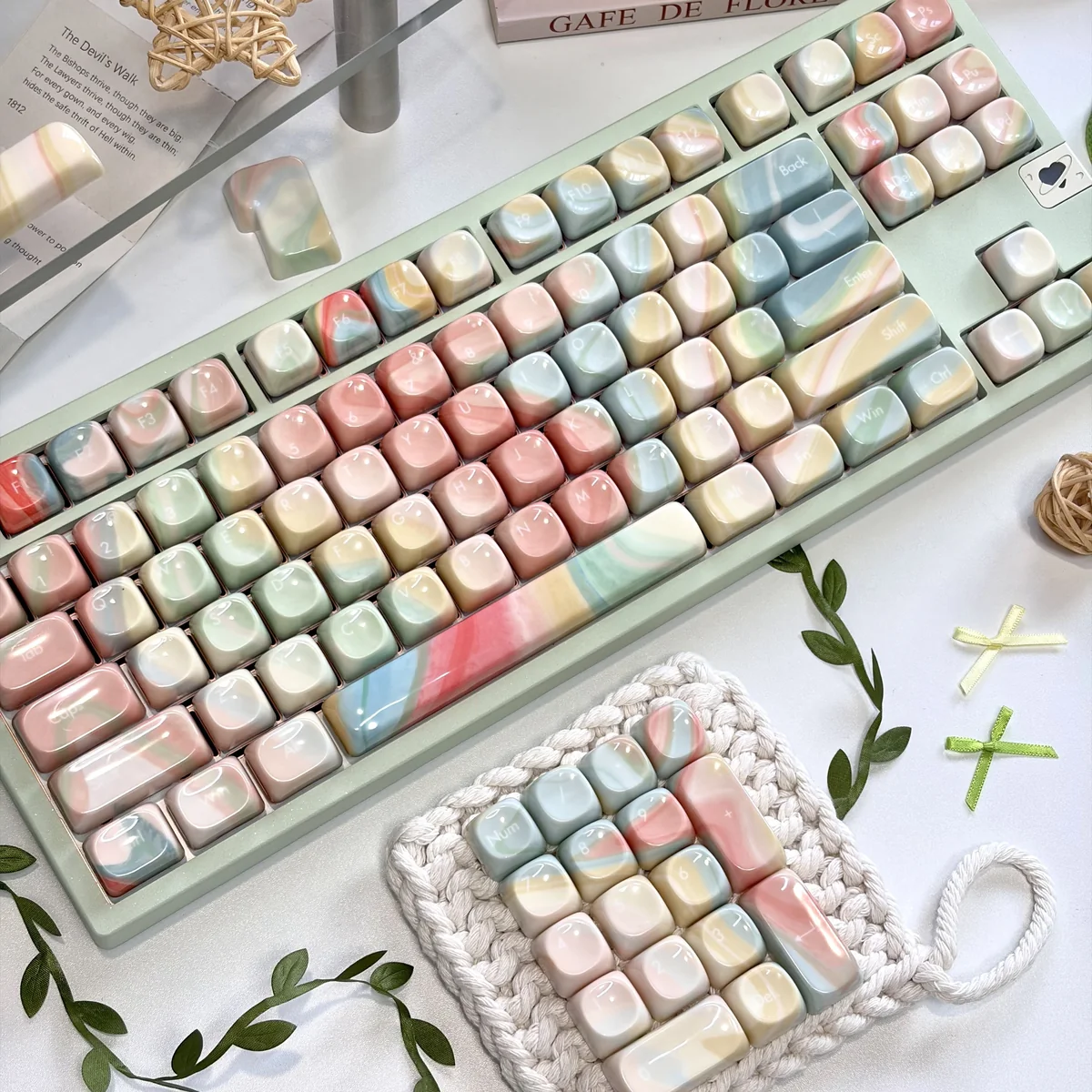 Translucent MOA keycaps in the 134-key Jade Dream set glow with pastel marble swirls across a full keyboard and matching keycap display.